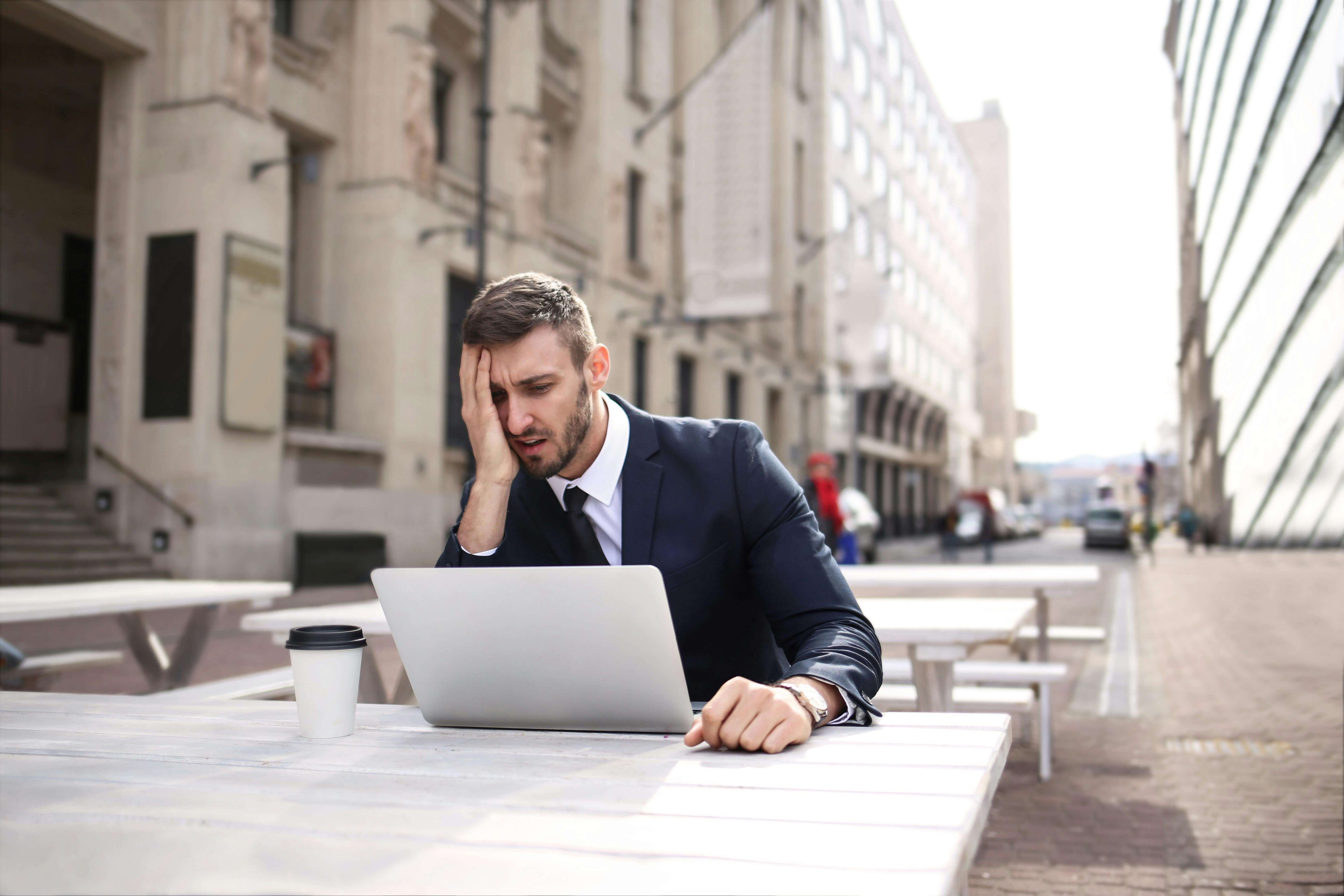 Person feeling overwhelmed and stressed at work